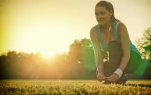 Woman going stretching before a morning run